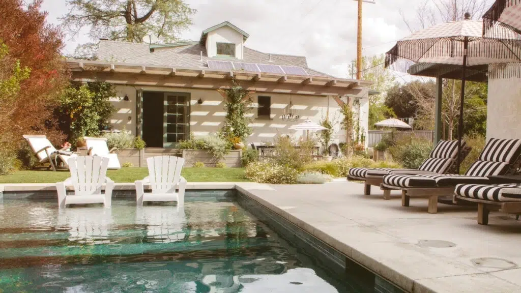 Backyard pool with lounge chairs