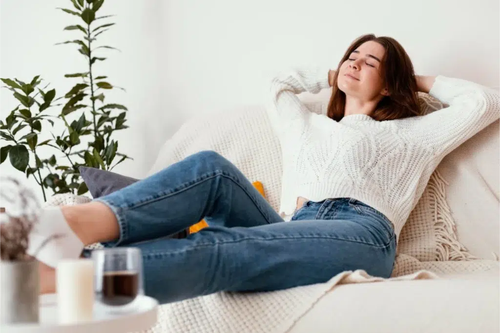 Woman relaxing on a cozy couch