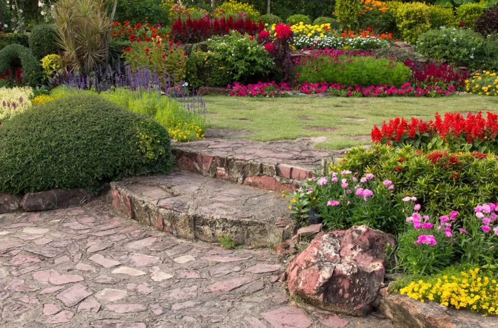 Beautifully landscaped garden with colorful flowers and stone steps.